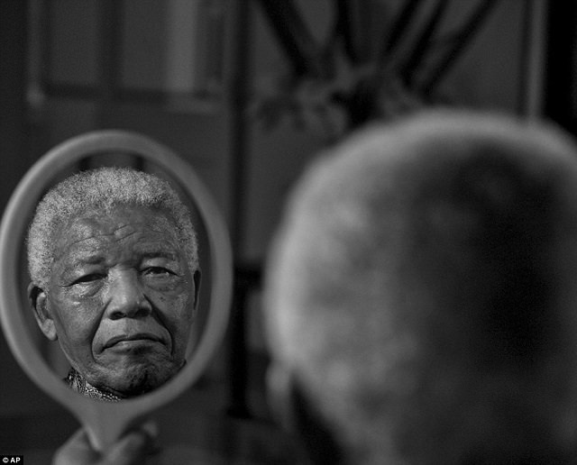 Nelson, 94, looking into his reflection, probably looking back into all his life