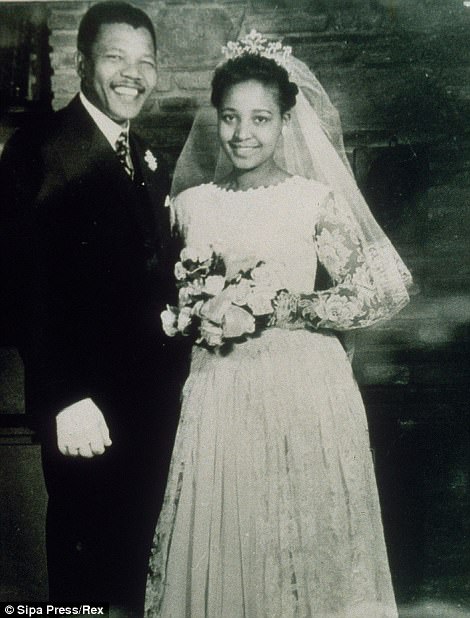 Nelson Mandela, 39, posing with his wife Winnie during their wedding