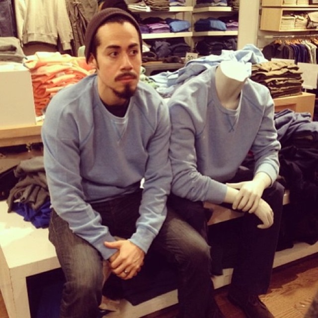 guy takes pictures with dummies